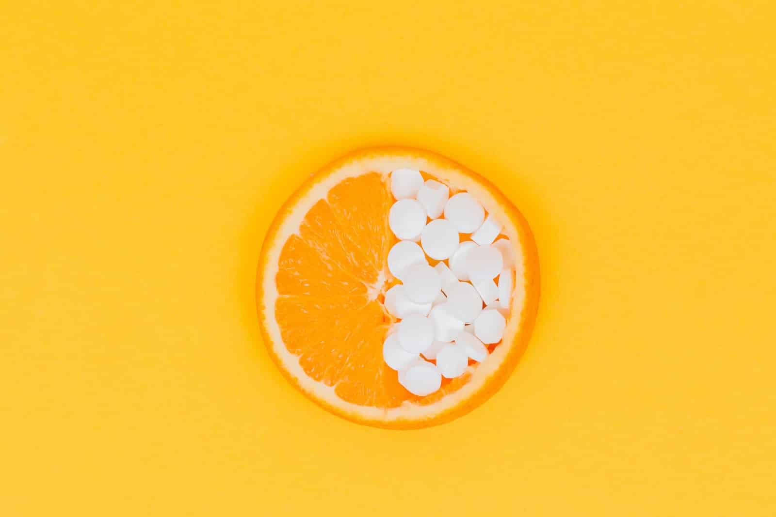 orange fruit slices on yellow surface